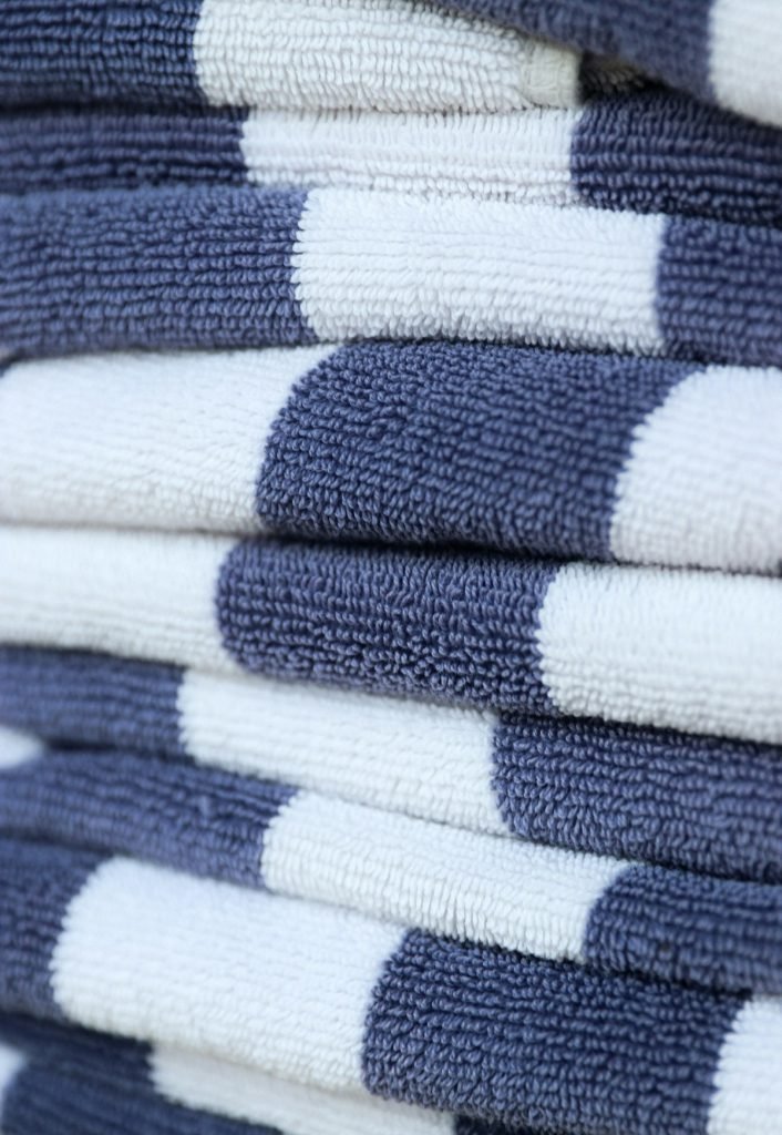 Stack of folded blue and white striped towels